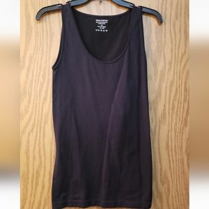 Very cute, black sleeveless tank top. Stretchy material. Size S/M.